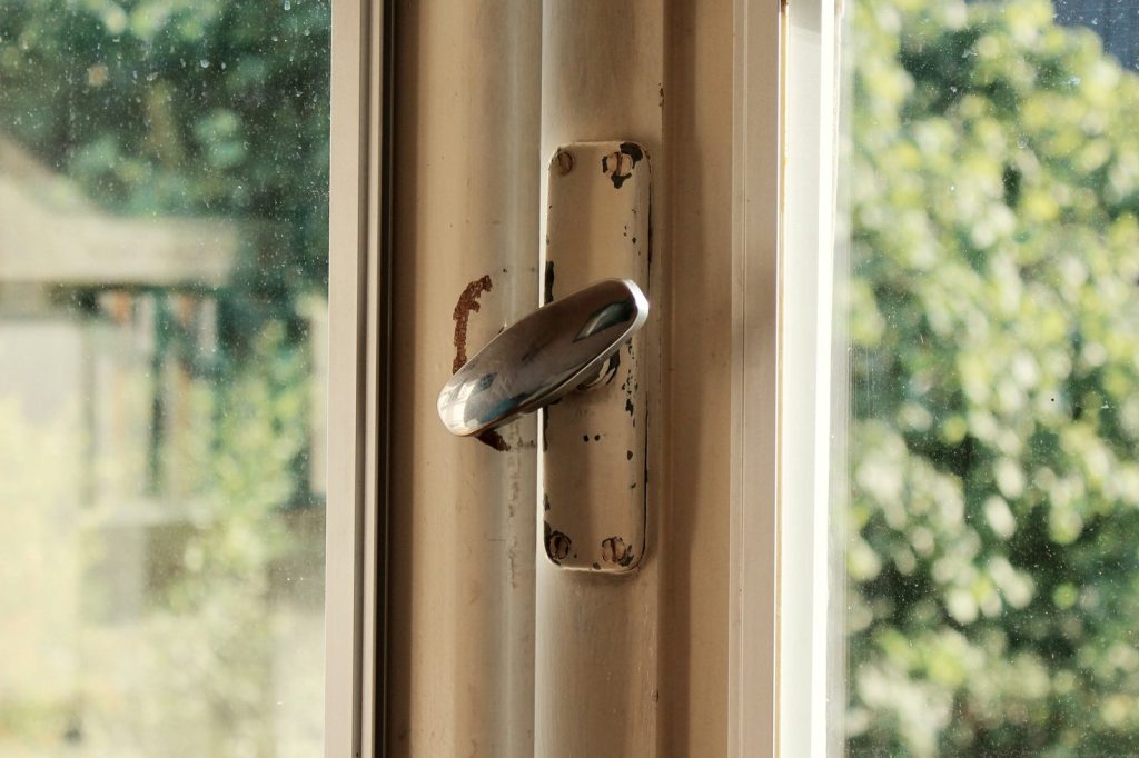 A door handle with a butterfly on it