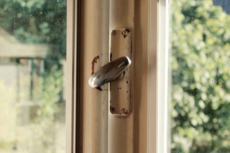 A door handle with a butterfly on it