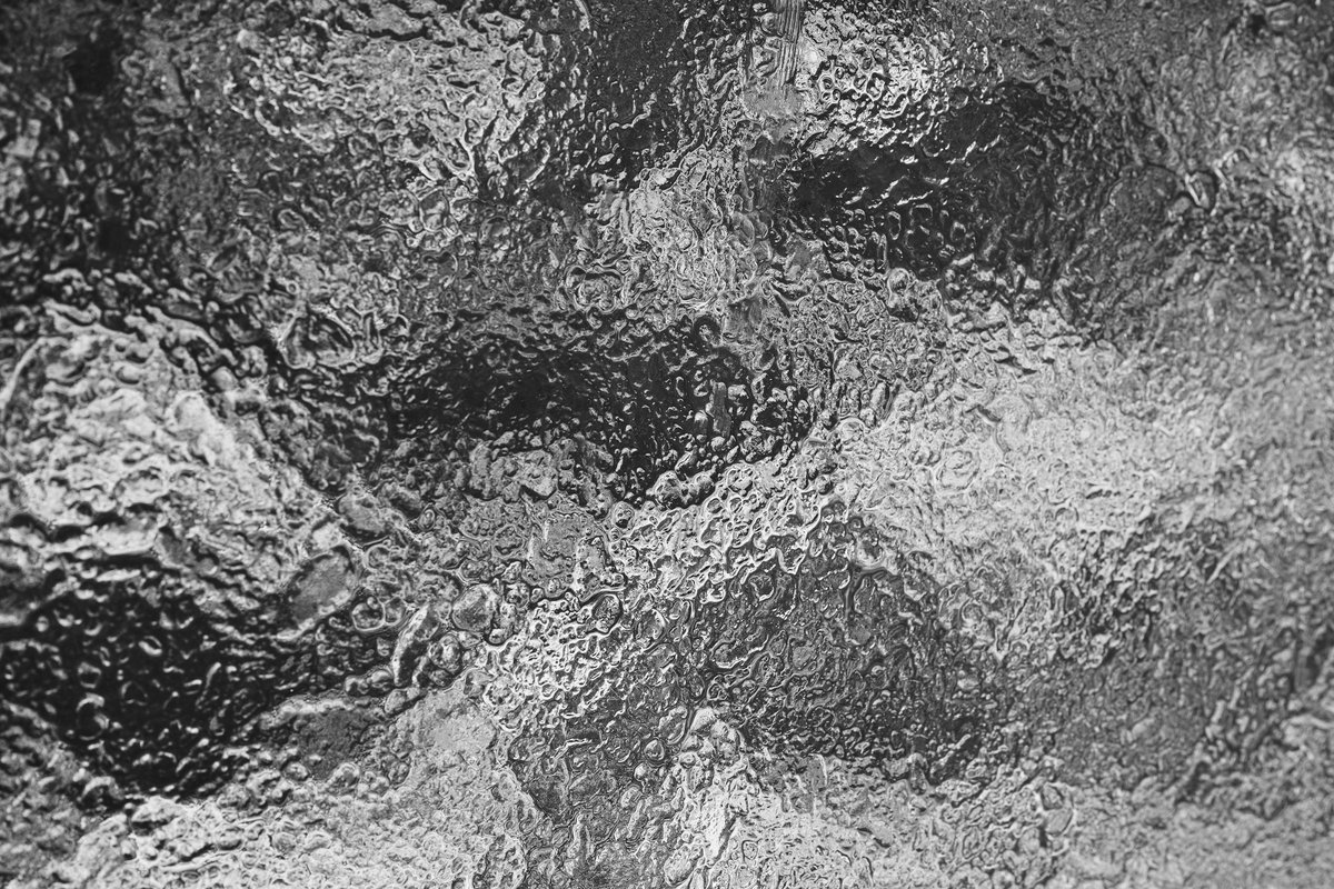 Frosted glass texture, evoking a sense of smoothness.