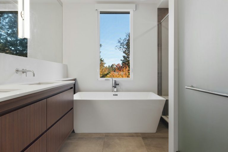 A bathroom with a tub and sink