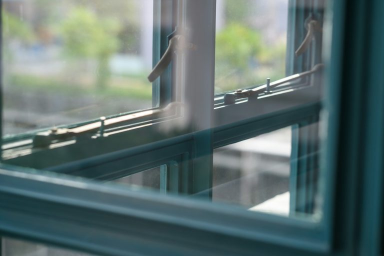 Grey metal framed glass window closed