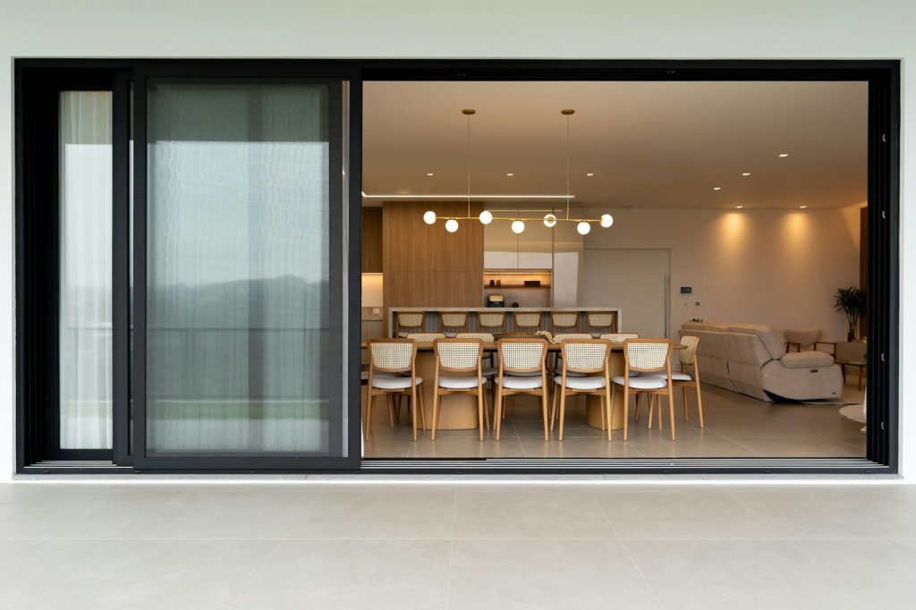 Modern dining room with chairs around a table.