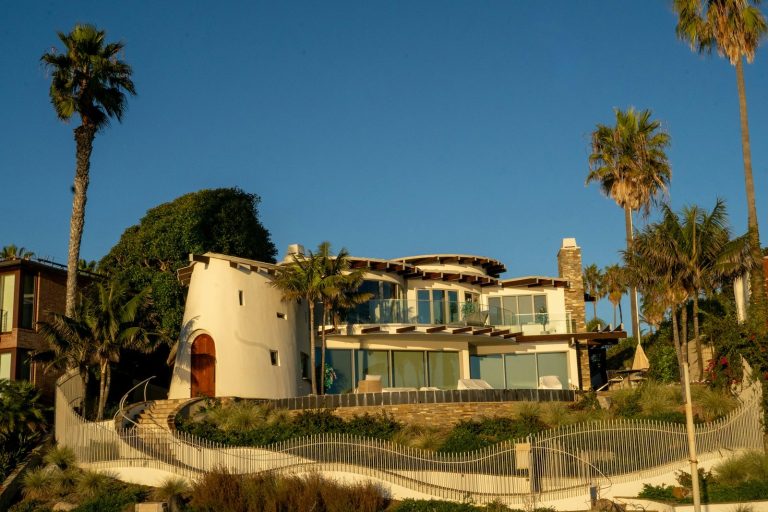 Modern house with tower and palm trees