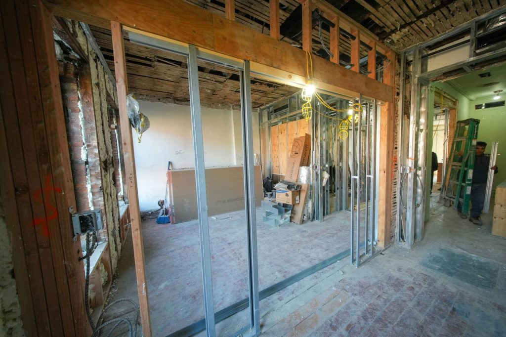 Interior construction with exposed beams and framing.