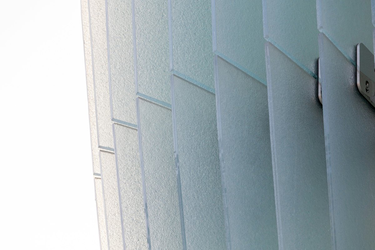 Frosted glass panels with metal fasteners