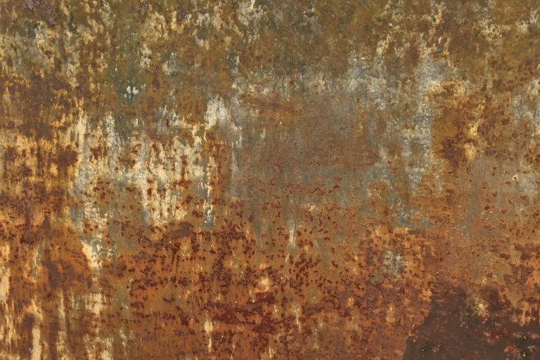 a rusted metal surface with lots of rust on it