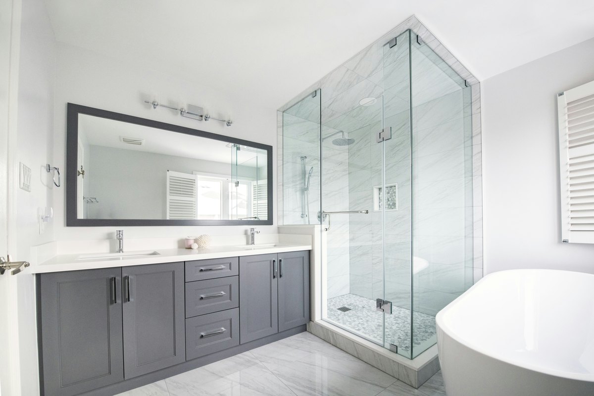 Modern bathroom with finished shower enclosure, showing the kind of result that depends on right-timed planning