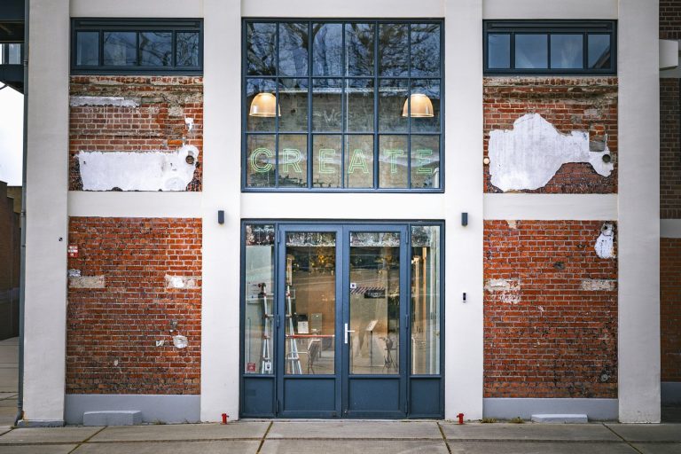 Entrance to a brick building with large windows
