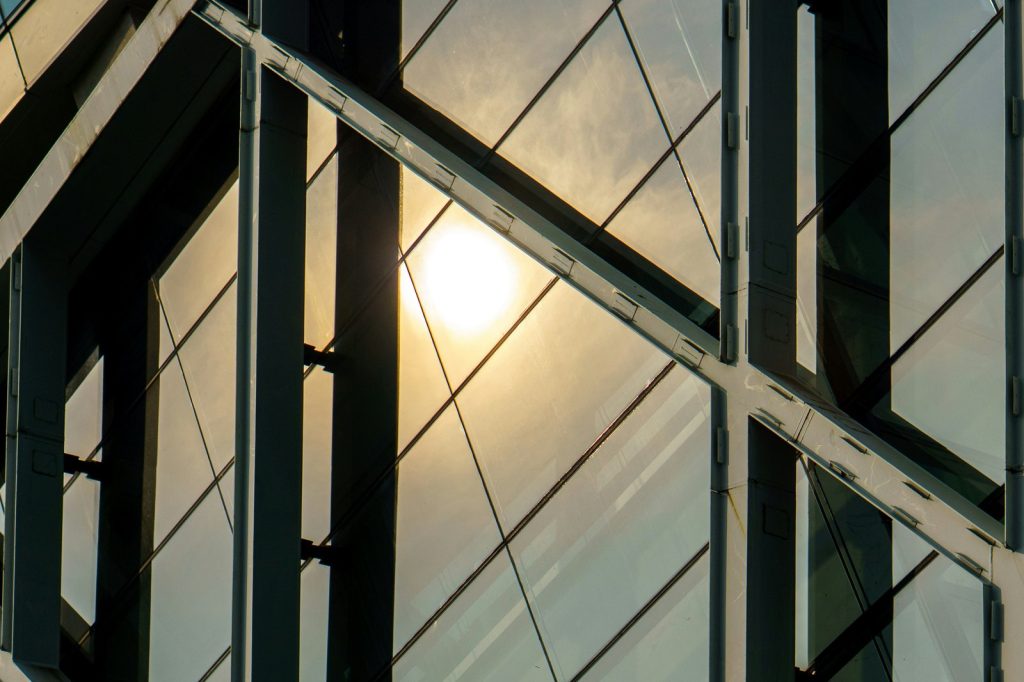 Sunlight reflects off the building's glass facade.