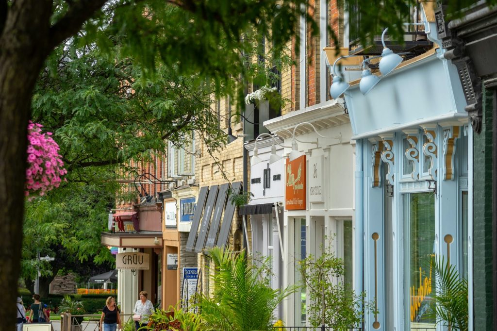 A row of quaint shops lines a city street.