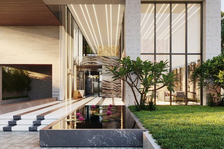 Modern building entrance with water feature and greenery