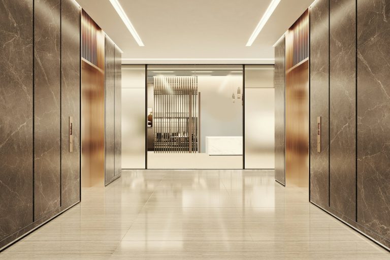 Modern elevator lobby with marble and glass accents