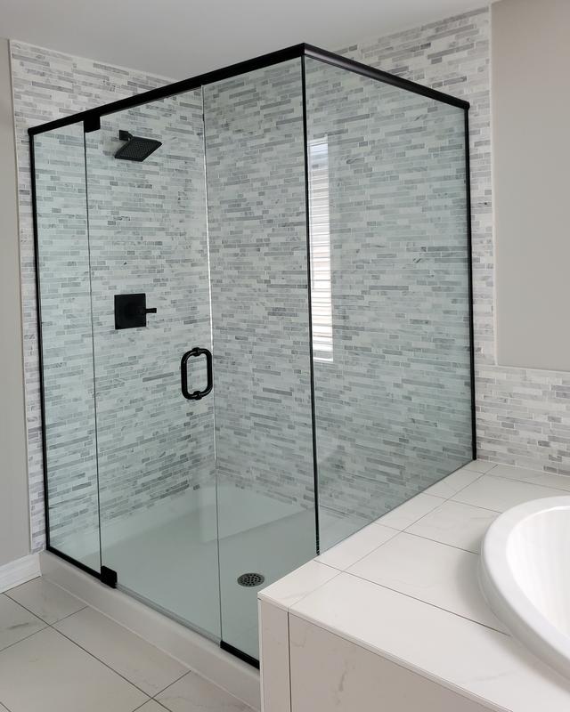 Clean modern shower enclosure with gray and white tile