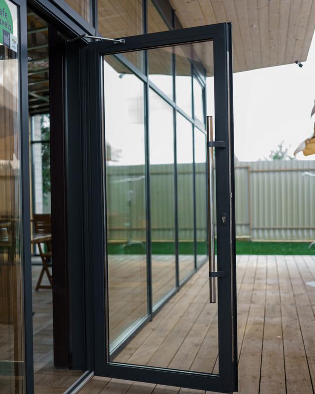 Elegant wooden home terrace with glass doors