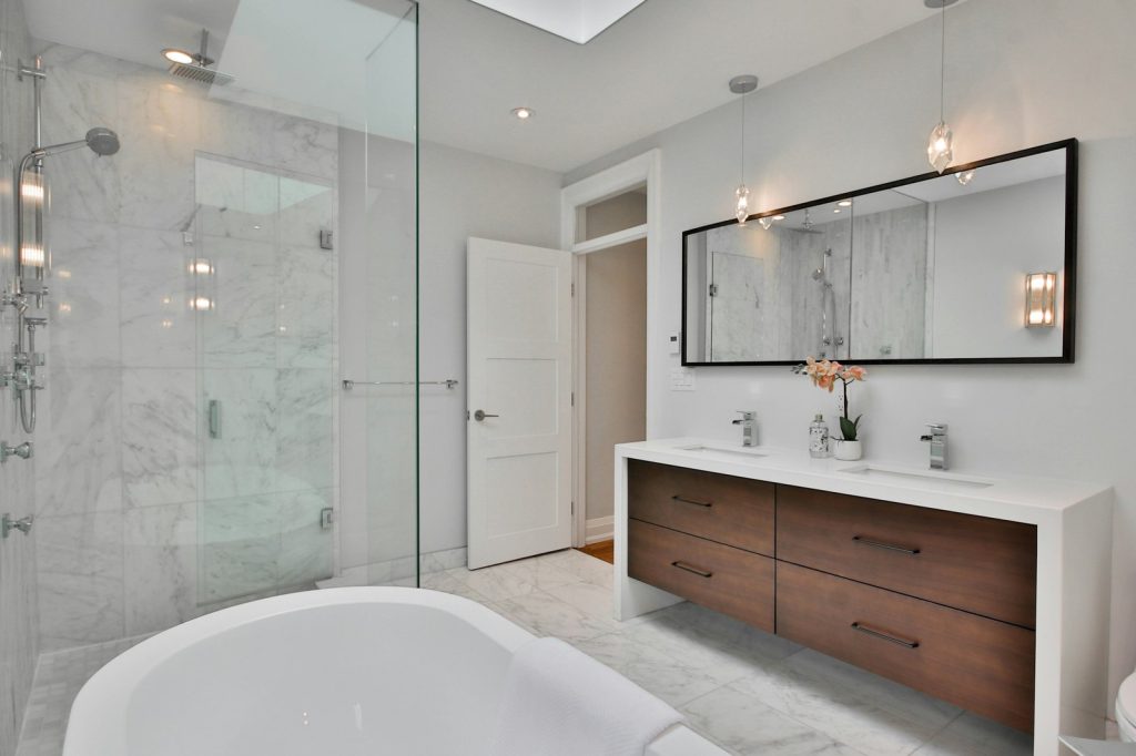 Norbrook Bathroom — Frameless Shower Enclosure - Norbrook, St. Andrew. Photo by Lotus Design N Print on Unsplash.