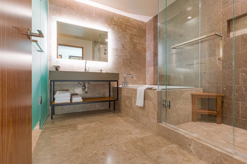 Frameless glass shower enclosure in a modern bathroom
